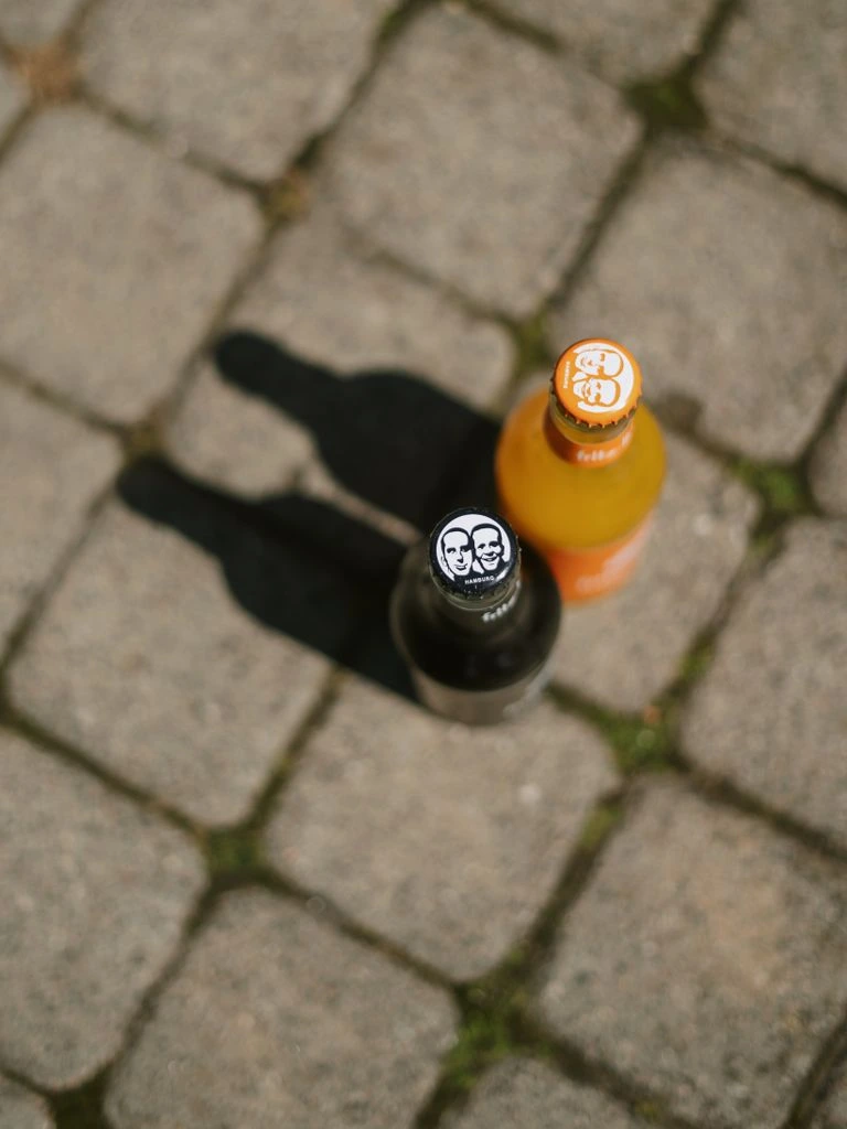 Single-estate extra virgin olive oil in a glass bottle on travertine